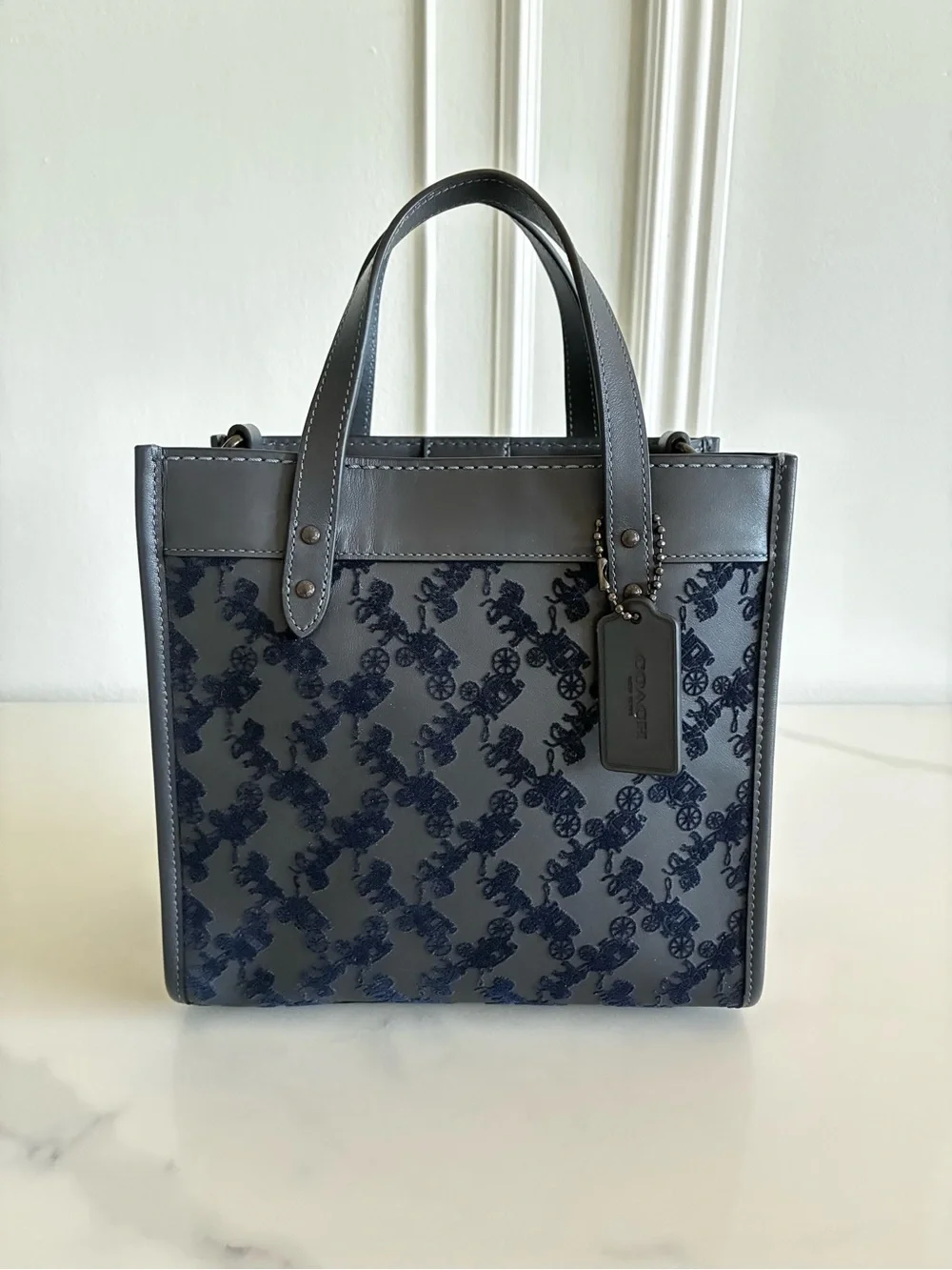 Coach Field Tote in midnight navy featuring a textured horse and carriage